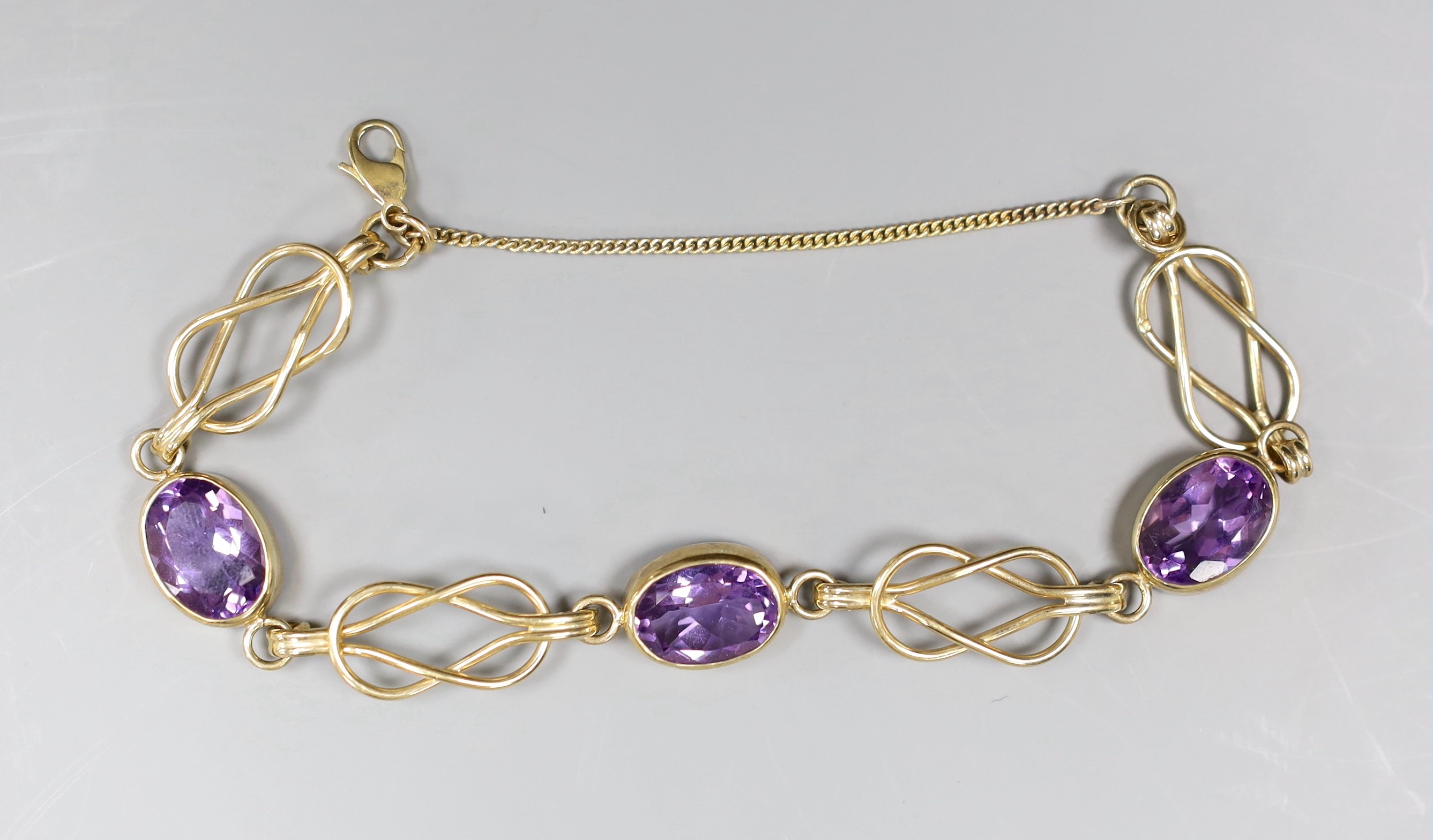 A 9ct gold and amethyst bracelet, gross 16.9 grams